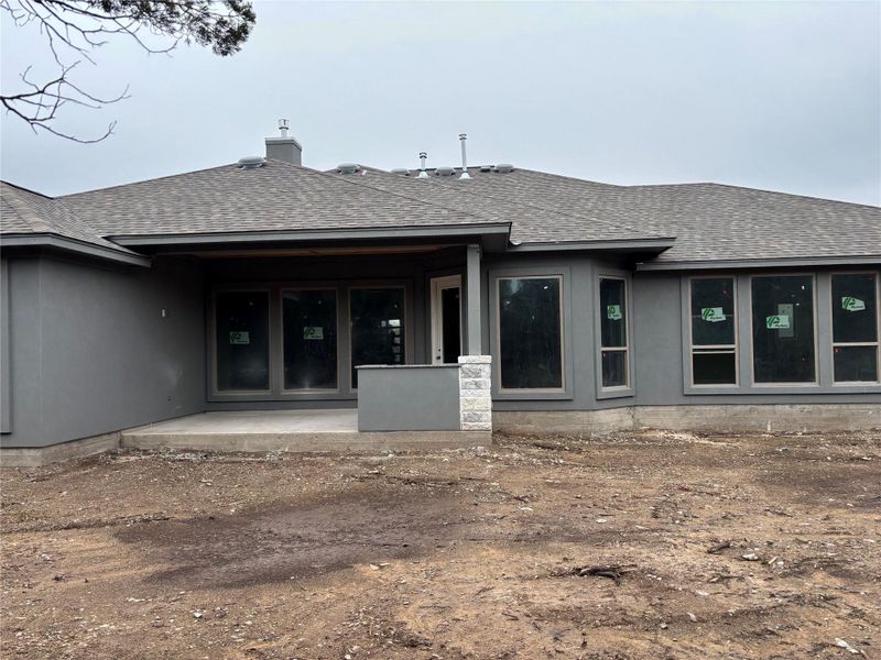 Exterior details and patio area of a home in The Hollows on Lake Travis, Leander (Image 21).