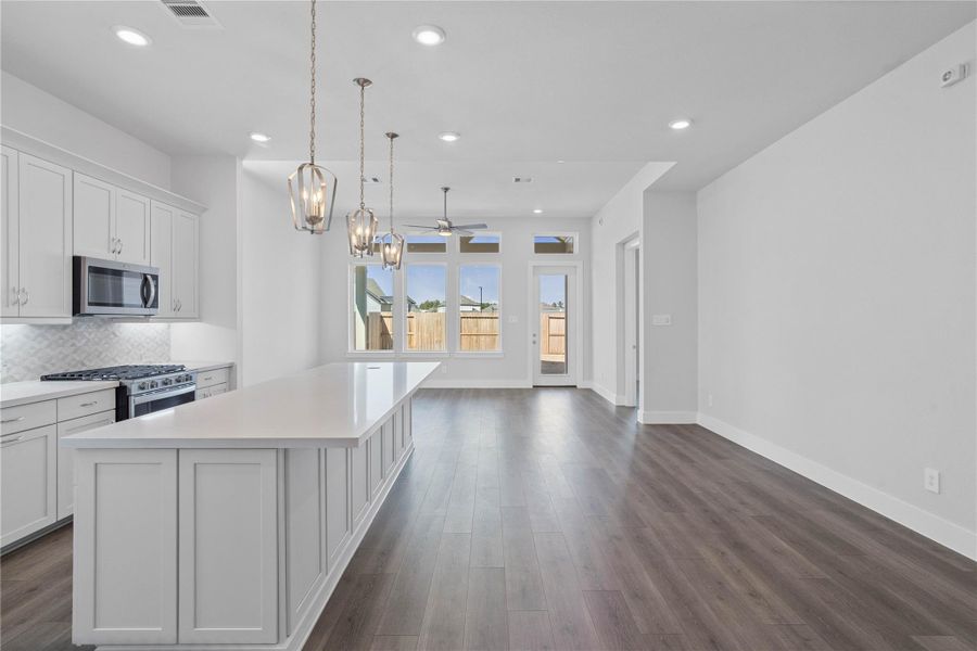 Step into a bright, expansive open-concept living space designed for modern life and seamless entertaining. Step into a bright, expansive open-concept living space designed for modern life and seamless entertaining.