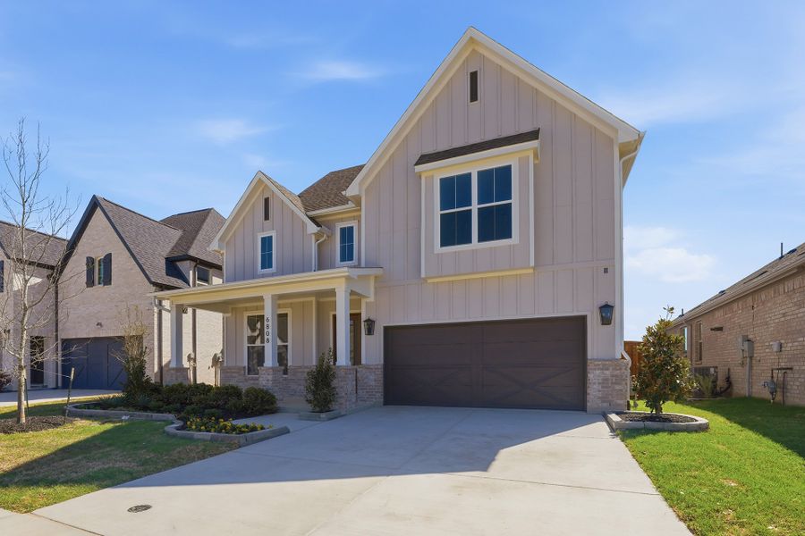 Front exterior of a new home in Aster Park, McKinney, TX, highlighting curb appeal (Image 23).