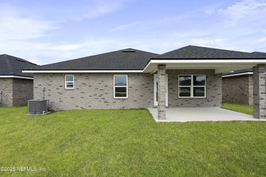 Exterior details and patio area of a home in Shadow Crest at Rolling Hills, Green Cove Springs (Image 3).