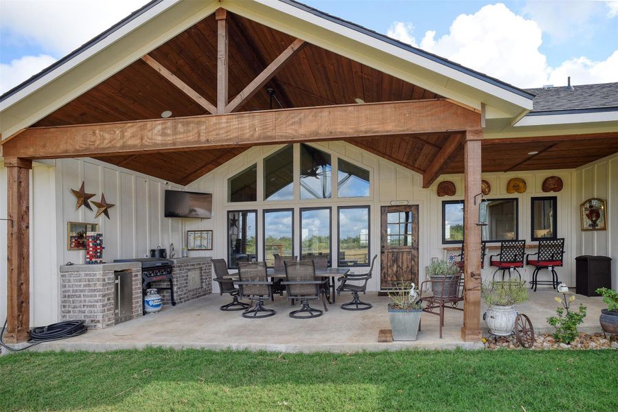 Back patio featuring outdoor kitchen.