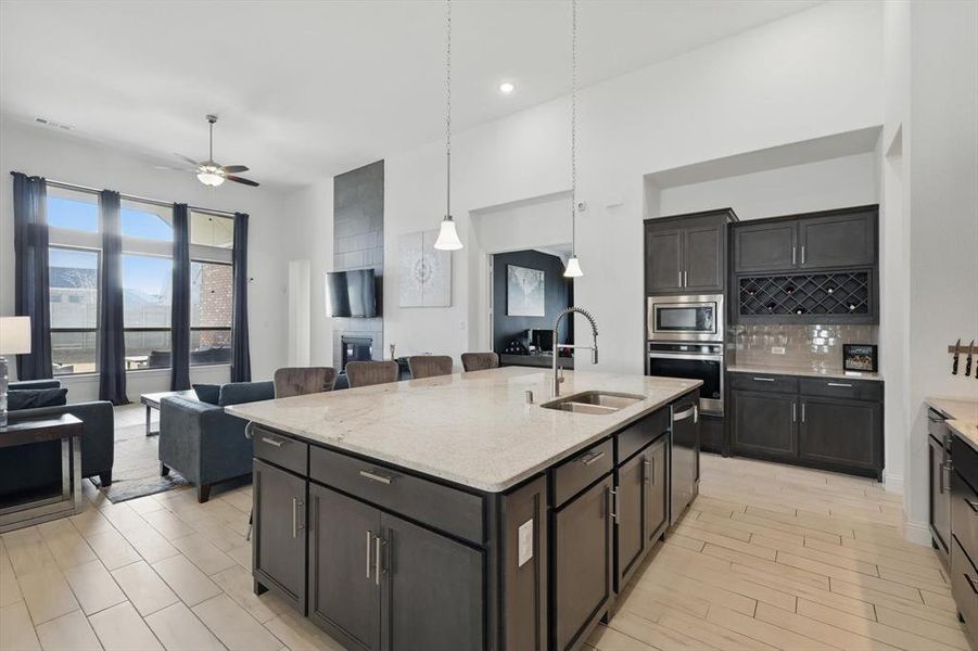 The Kitchen even offers a nice sized Wine Rack and fantastic storage in the Oversized Island.