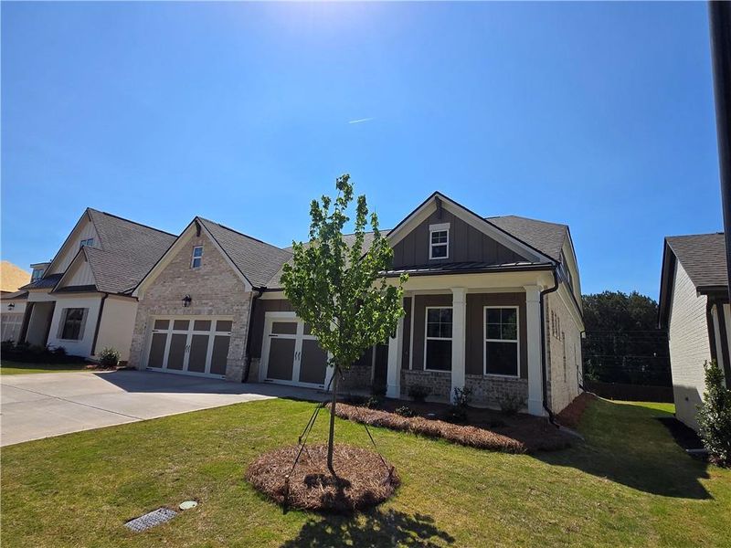 Front exterior of a new home in Pinecrest Ridge, Dacula, GA, highlighting curb appeal (Image 14).