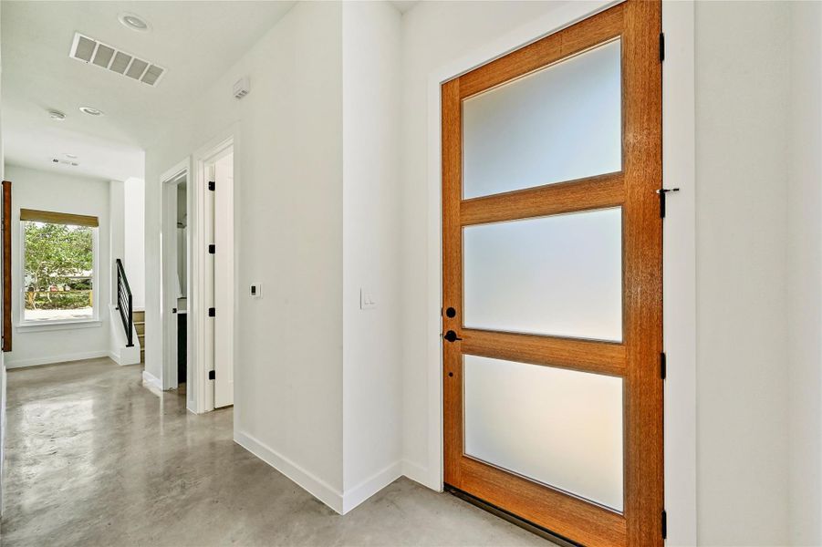 Entry foyer with beautiful wood and frosted glass front door. Entry foyer with beautiful wood and frosted glass front door.