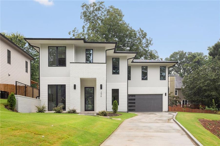 Front exterior of a new home in , Scottdale, GA, highlighting curb appeal (Image 1). Front exterior of a new home in , Scottdale, GA, highlighting curb appeal (Image 1).
