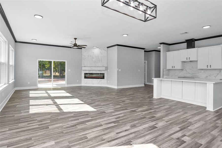 Another view of dining and living room. Look at that fireplace!