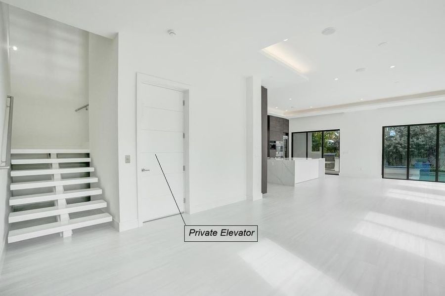 Private Elevator adjacent to Floating Stairs