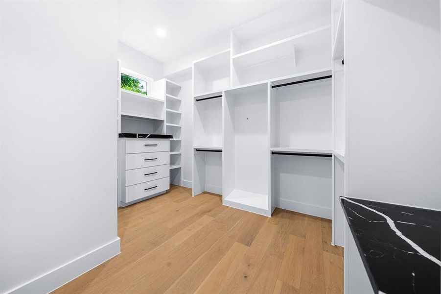 Oversized closet with built ins and vanity