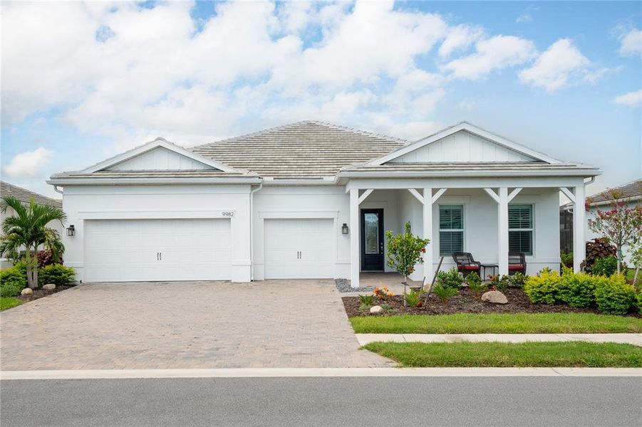 Front exterior of a new home in , Englewood, FL, highlighting curb appeal (Image 1). Front exterior of a new home in , Englewood, FL, highlighting curb appeal (Image 1).