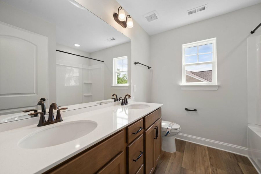 Furnished interior view inside a new home in Cottages at Piper Village, Trinity (Image 11).