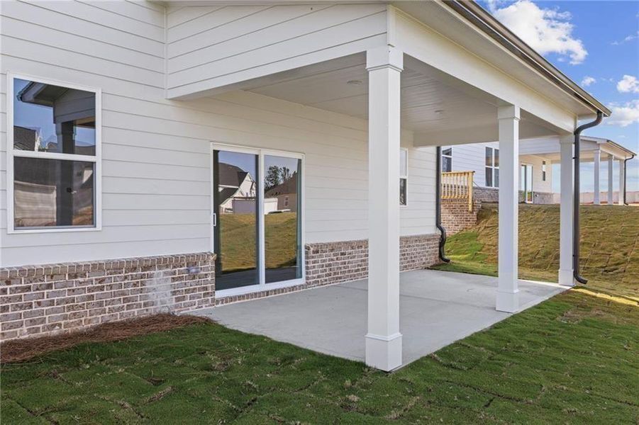 Exterior details and patio area of a home in The Estates at Gainesville Township, Gainesville (Image 32).