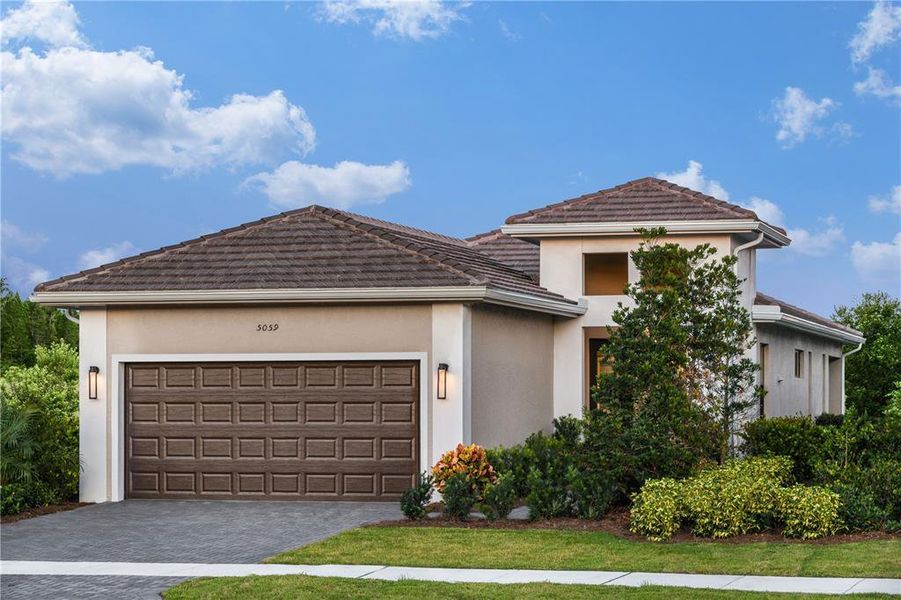 Front exterior of a new home in Cresswind Lakewood Ranch, Lakewood Ranch, FL, highlighting curb appeal (Image 1). Front exterior of a new home in Cresswind Lakewood Ranch, Lakewood Ranch, FL, highlighting curb appeal (Image 1).