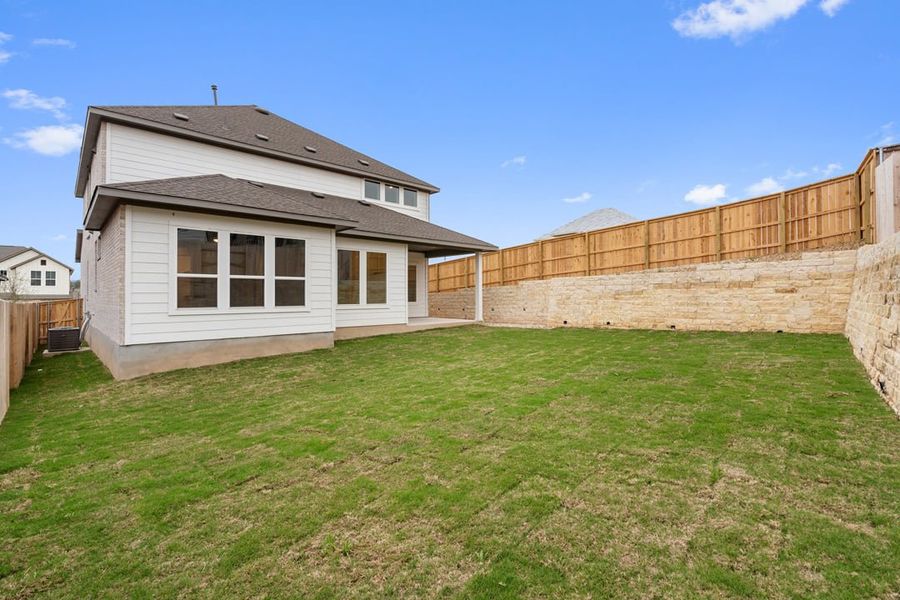 Exterior details and patio area of a home in Park Collection at Lariat, Liberty Hill (Image 31).