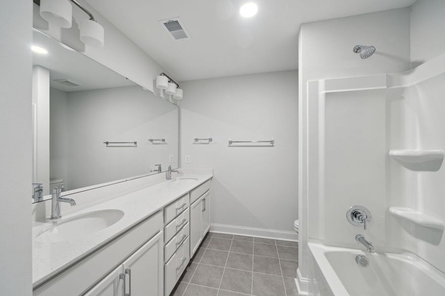 Furnished interior view inside a new home in Tidewater at Lakes of Cane Bay, Summerville (Image 13).