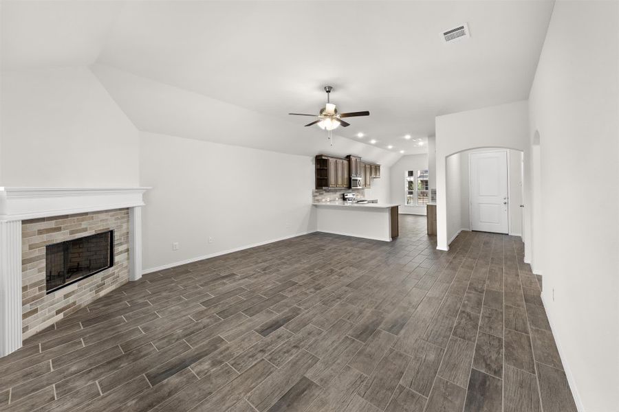 Family Room to Kitchen | Concept 1638 at Chisholm Hills in Cleburne, TX by Landsea Homes