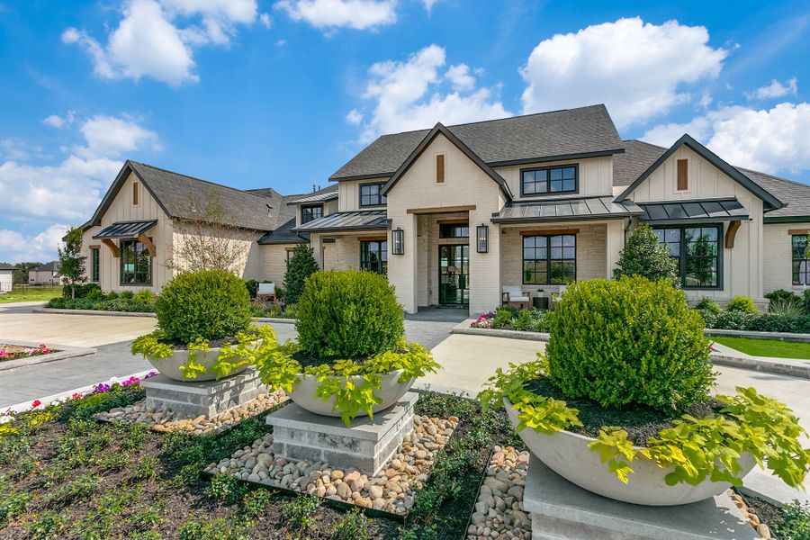 Front exterior of a new home in Hilltop Ranch, Leander, TX, highlighting curb appeal (Image 7).