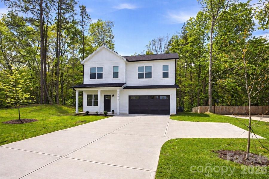 Front exterior of a new home in , Charlotte, NC, highlighting curb appeal (Image 22).