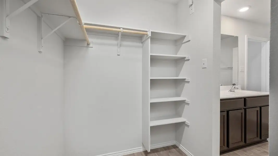 Walk in closet featuring light wood finished floors
