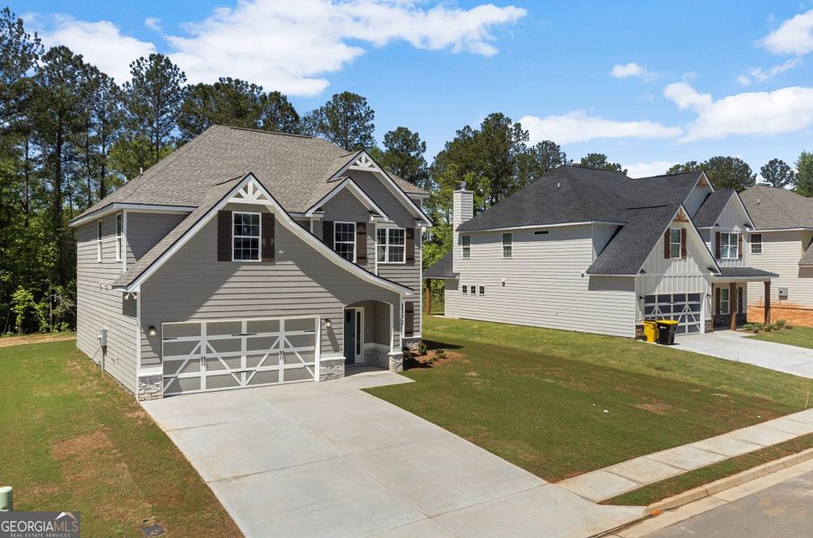 Front exterior of a new home in Juliette Crossing, Forsyth, GA, highlighting curb appeal (Image 2).