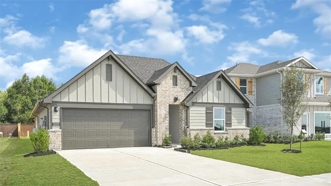 Front exterior of a new home in August Trails, Needville, TX, highlighting curb appeal (Image 2). Front exterior of a new home in August Trails, Needville, TX, highlighting curb appeal (Image 2).
