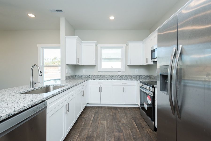 Representative furnished interior of a home built from the Monroe II by Foundation Home Builders LLC in Pinnix Loop, Burlington (Image 7).