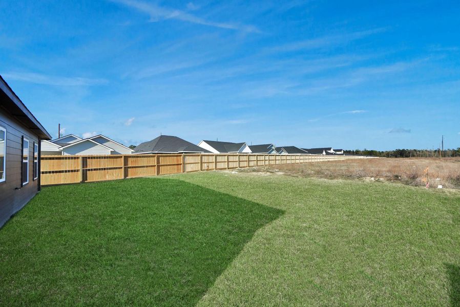 Exterior details and patio area of a home in Hill & Dale Ranch, Splendora (Image 22).