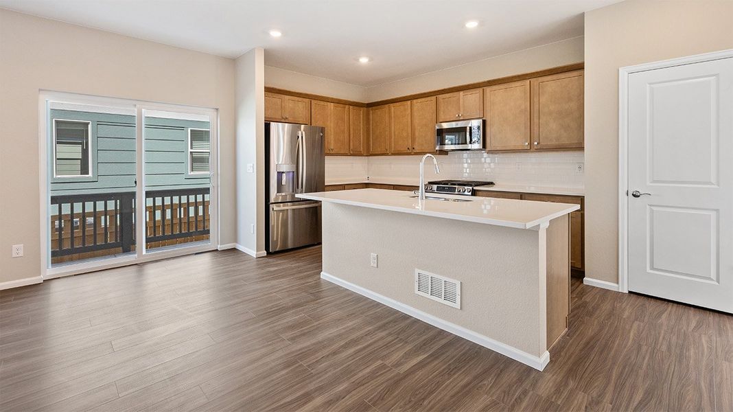 Furnished interior view inside a new home in Woodrose at Painted Prairie, Aurora (Image 3).