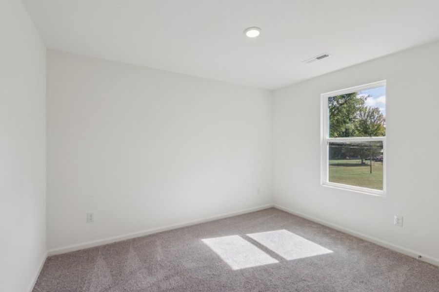 A room with a window and a rug in it. A room with a window and a rug in it.