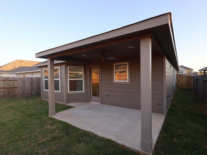 Exterior details and patio area of a home in Pinewood at Grand Texas, New Caney (Image 1).