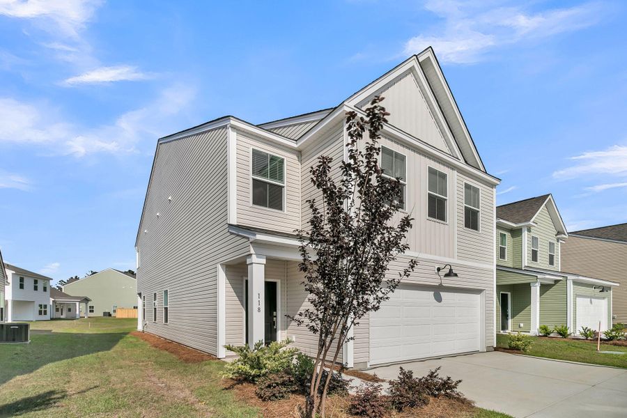Front exterior of a new home in Wildcat Chase, Summerville, SC, highlighting curb appeal (Image 2). Front exterior of a new home in Wildcat Chase, Summerville, SC, highlighting curb appeal (Image 2).