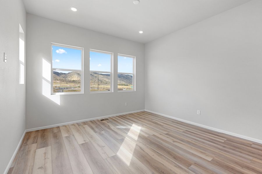 Spacious, unfurnished interior of a new home in The Manors Collection at Golden Overlook, Lakewood (Image 10).