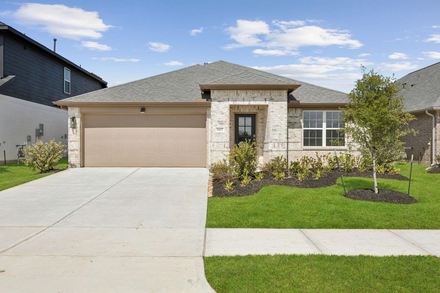 Front exterior of a new home in Saint Tropez, Houston, TX, highlighting curb appeal (Image 1). Front exterior of a new home in Saint Tropez, Houston, TX, highlighting curb appeal (Image 1).