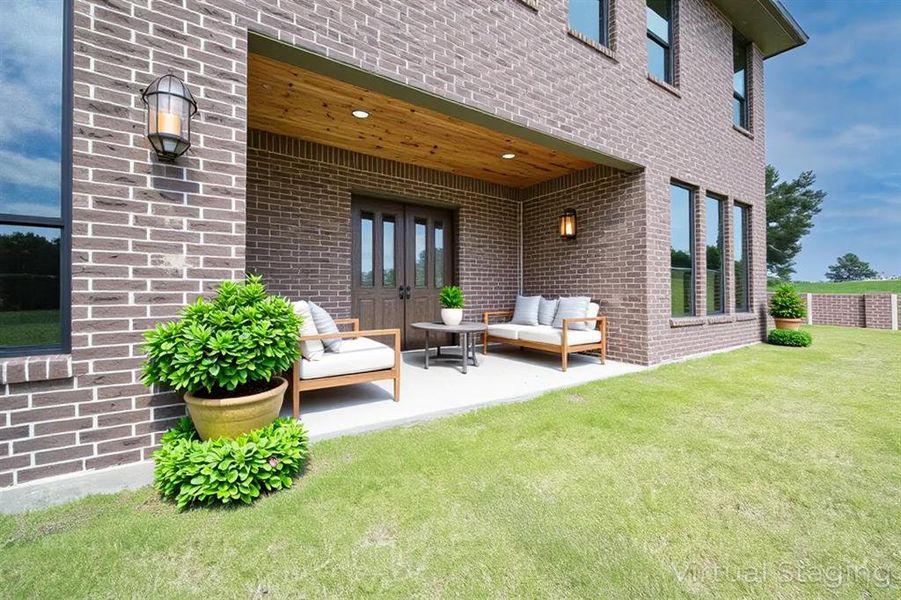 View of patio with french doors and outdoor lounge area