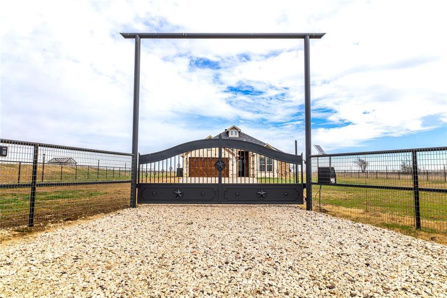 View of gate featuring a fenced front yard