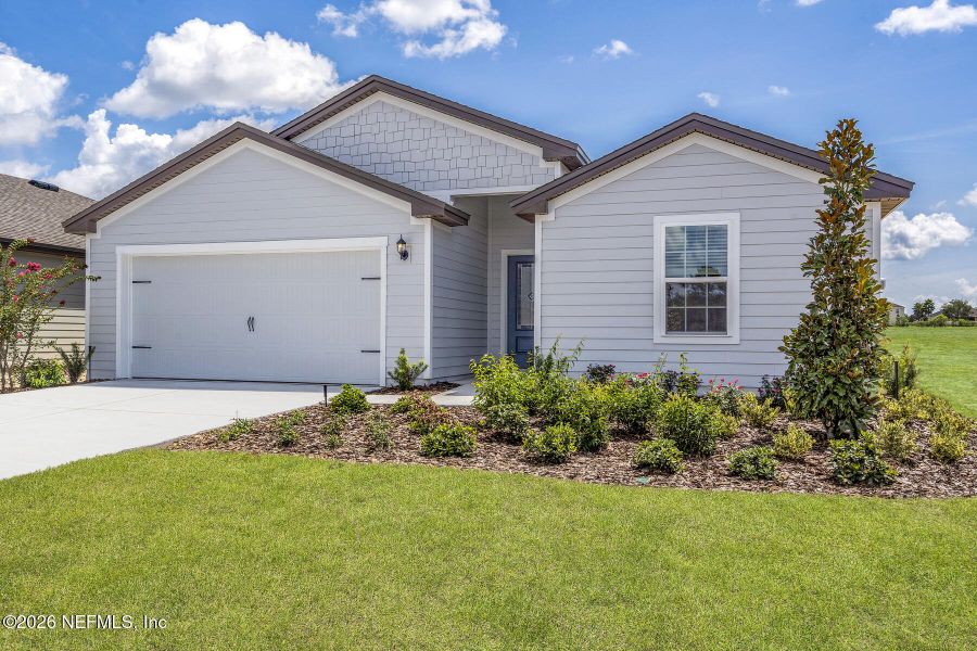 Front exterior of a new home in Rolling Hills, Green Cove Springs, FL, highlighting curb appeal (Image 19). Front exterior of a new home in Rolling Hills, Green Cove Springs, FL, highlighting curb appeal (Image 19).