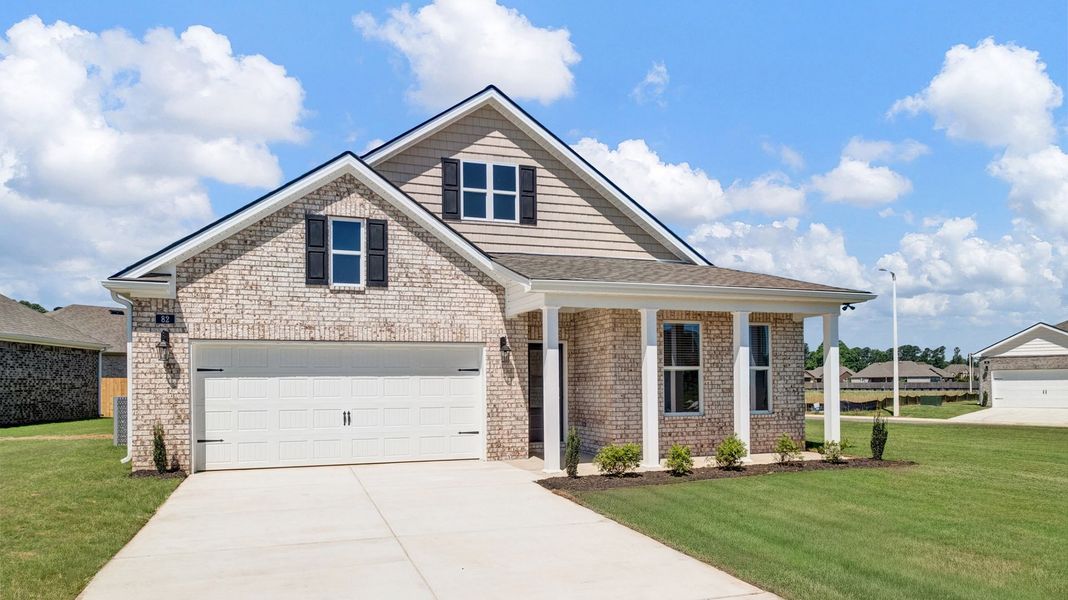 Front exterior of a new home in The Orchard, Millington, TN, highlighting curb appeal (Image 22).
