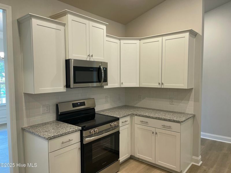 Furnished interior view inside a new home in Mill Creek Cove, Bolivia (Image 7).
