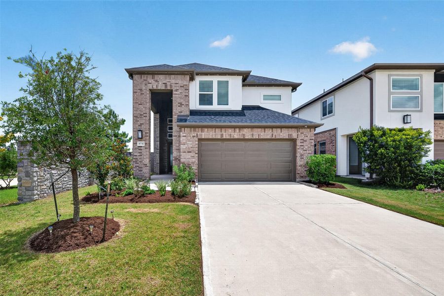 Front exterior of a new home in Avalon at Cypress, Cypress, TX, highlighting curb appeal (Image 2). Front exterior of a new home in Avalon at Cypress, Cypress, TX, highlighting curb appeal (Image 2).