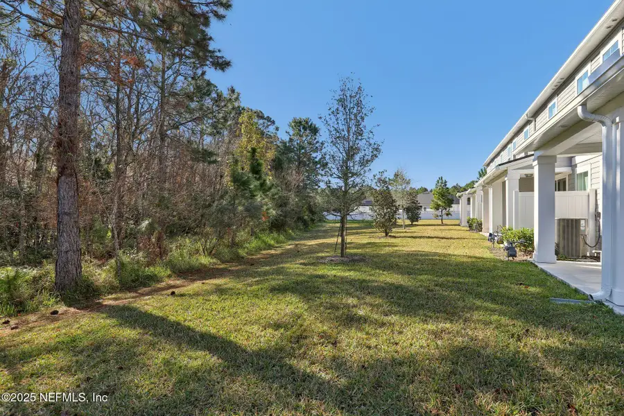 Exterior details and patio area of a home in Brandon Lakes at Silver Landing, St. Augustine (Image 4).
