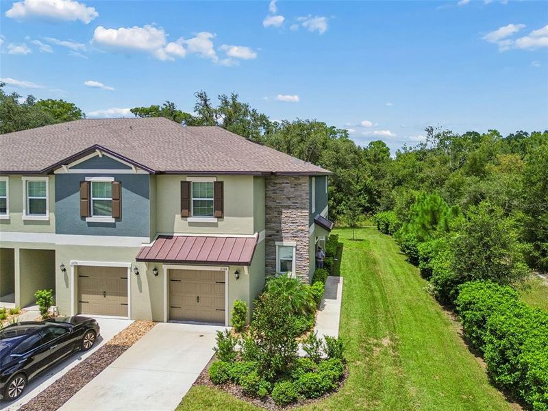 Front exterior of a new home in , Land O' Lakes, FL, highlighting curb appeal (Image 24).
