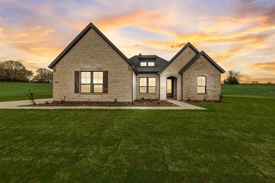 Front exterior of a new home in King Crossing Estates, Van Alstyne, TX, highlighting curb appeal (Image 2). Front exterior of a new home in King Crossing Estates, Van Alstyne, TX, highlighting curb appeal (Image 2).