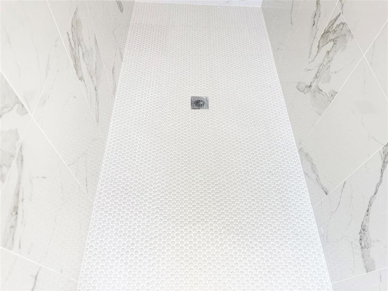 Bathroom view of a tile shower