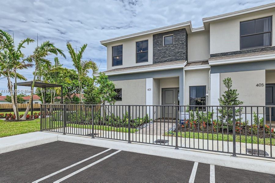 Front exterior of a new home in , Florida City, FL, highlighting curb appeal (Image 2). Front exterior of a new home in , Florida City, FL, highlighting curb appeal (Image 2).