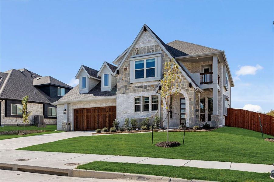 Front exterior of a new home in Ridgepoint, Midlothian, TX, highlighting curb appeal (Image 2).