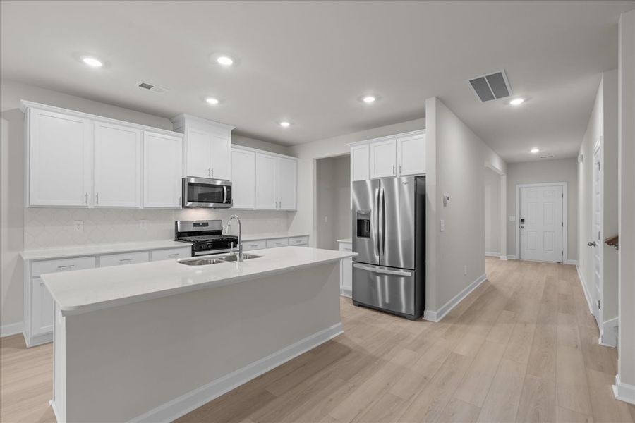 Furnished interior view inside a new home in The Farm at Wells Creek - Signature Collection, Gray Court (Image 7). Furnished interior view inside a new home in The Farm at Wells Creek - Signature Collection, Gray Court (Image 7).