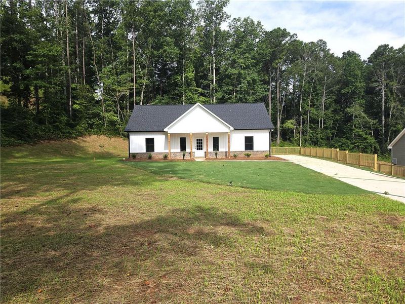 Front exterior of a new home in , Dallas, GA, highlighting curb appeal (Image 2). Front exterior of a new home in , Dallas, GA, highlighting curb appeal (Image 2).