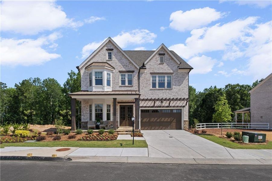 Front exterior of a new home in Laurel View, Suwanee, GA, highlighting curb appeal (Image 2). Front exterior of a new home in Laurel View, Suwanee, GA, highlighting curb appeal (Image 2).