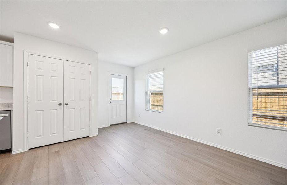 Dining nook off kitchen with large windows Dining nook off kitchen with large windows