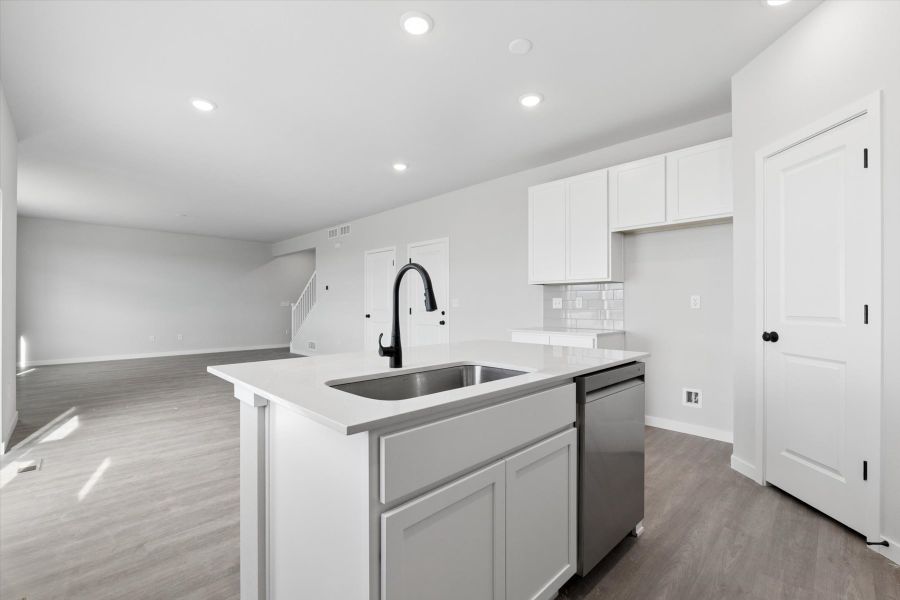 A kitchen with white cabinets. A kitchen with white cabinets.
