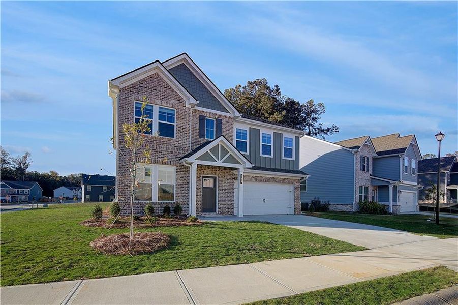 Front exterior of a new home in Westminster, Covington, GA, highlighting curb appeal (Image 16).